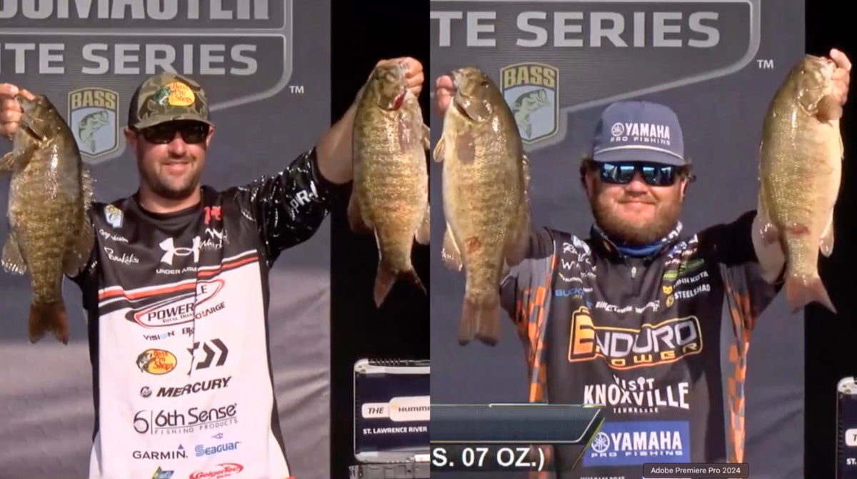Bass tournament anglers holding St. Lawrence River smallmouth onstage