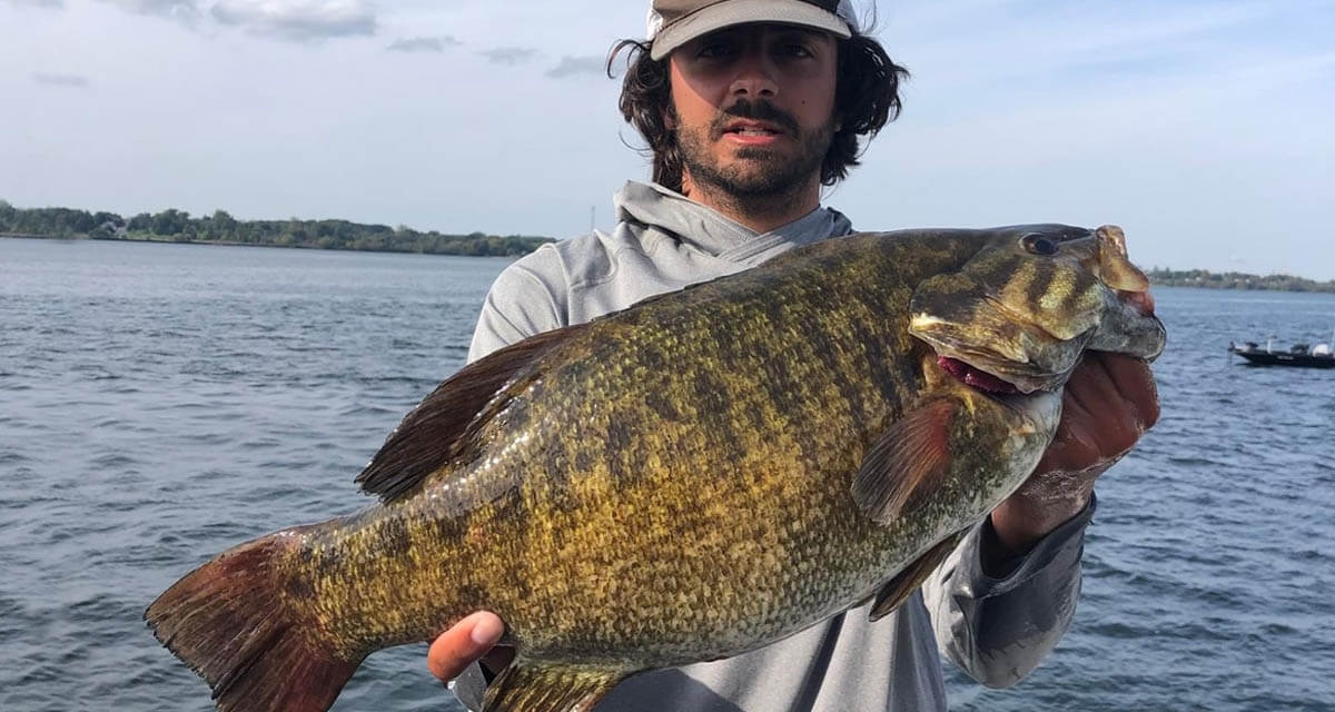 New York bass tournament angler holding a trophy St. Lawrence River smallmouth