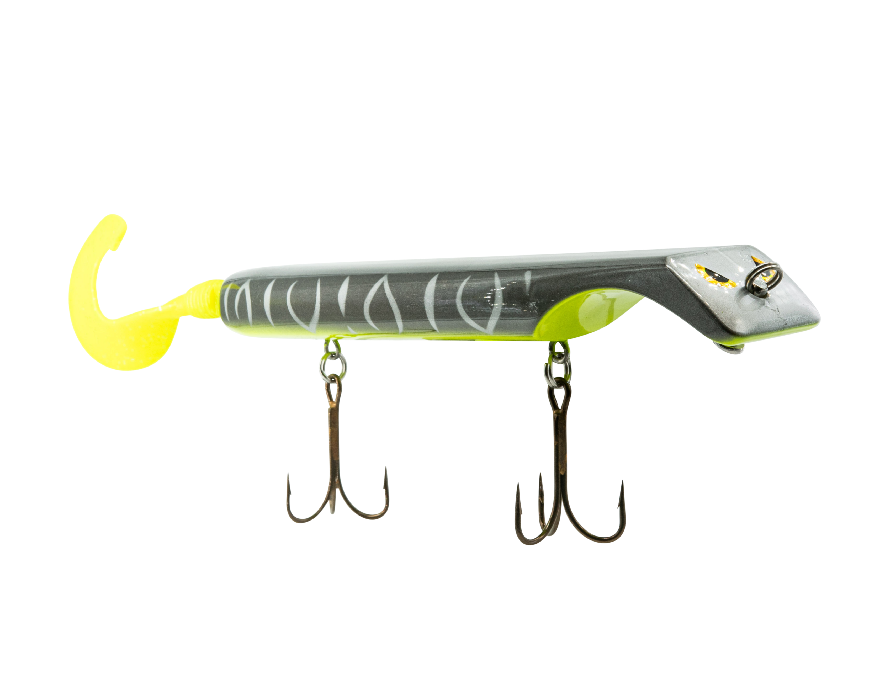 Fishing lure with a yellow hook and black and white body on a white background