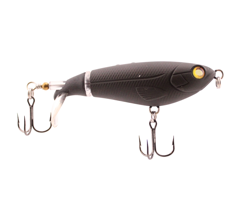 Black fishing lure with gold eye and treble hooks on a white background