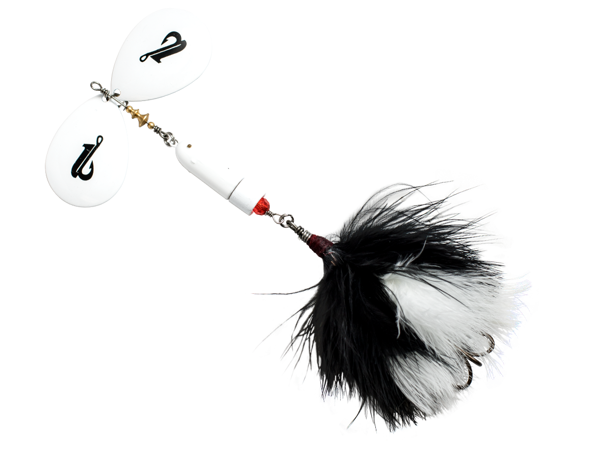 Fishing lure with black and white feathers on a white background