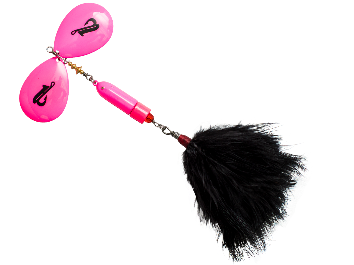 Pink fishing lure with a black feather on a white background