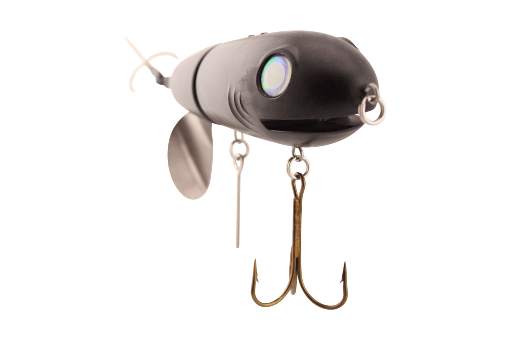 Fishing lure with propeller and treble hooks on a white background