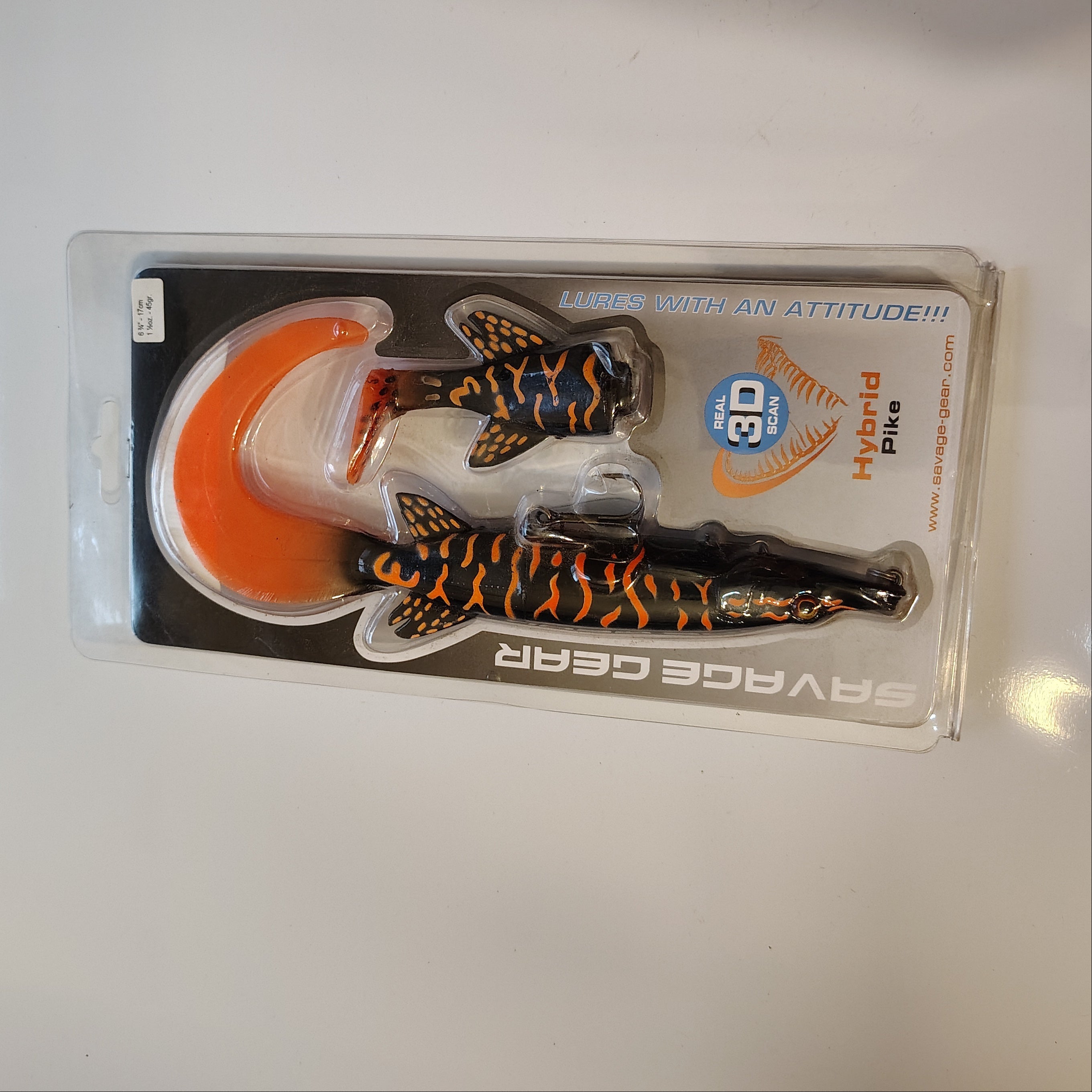 Fishing lure in packaging on a white surface