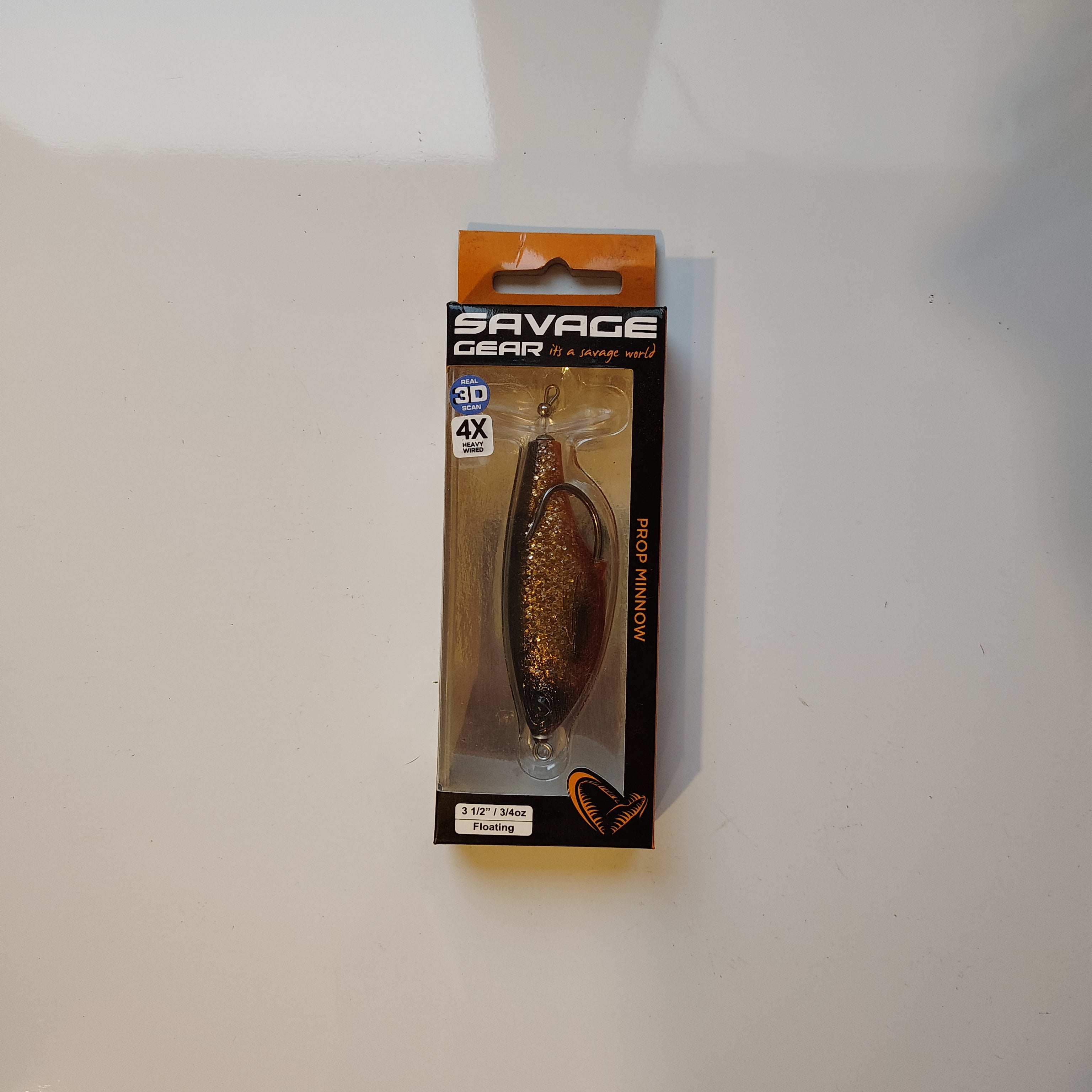 top water fishing lure in a box with a white background.