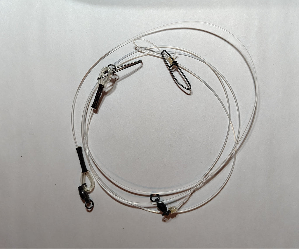 Coiled cable with clamps on a white background