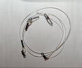 Coiled cable with clamps on a white background