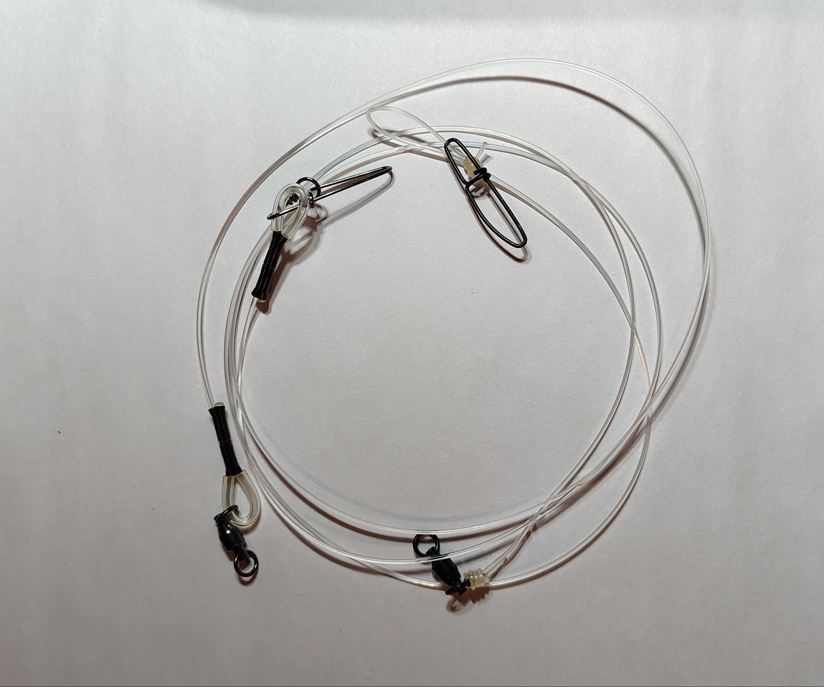 Coiled cable with clamps on a white background