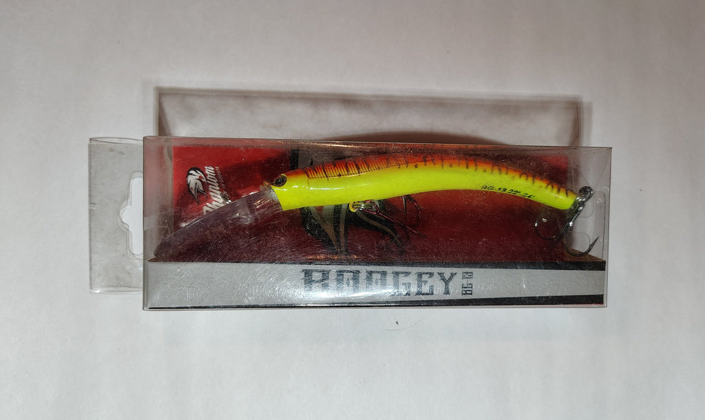 Yellow and black fishing lure in packaging on a white background