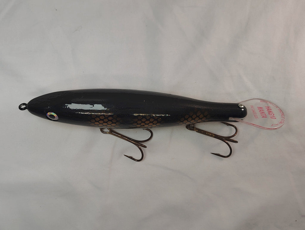 Black fishing lure with a tag on a white background