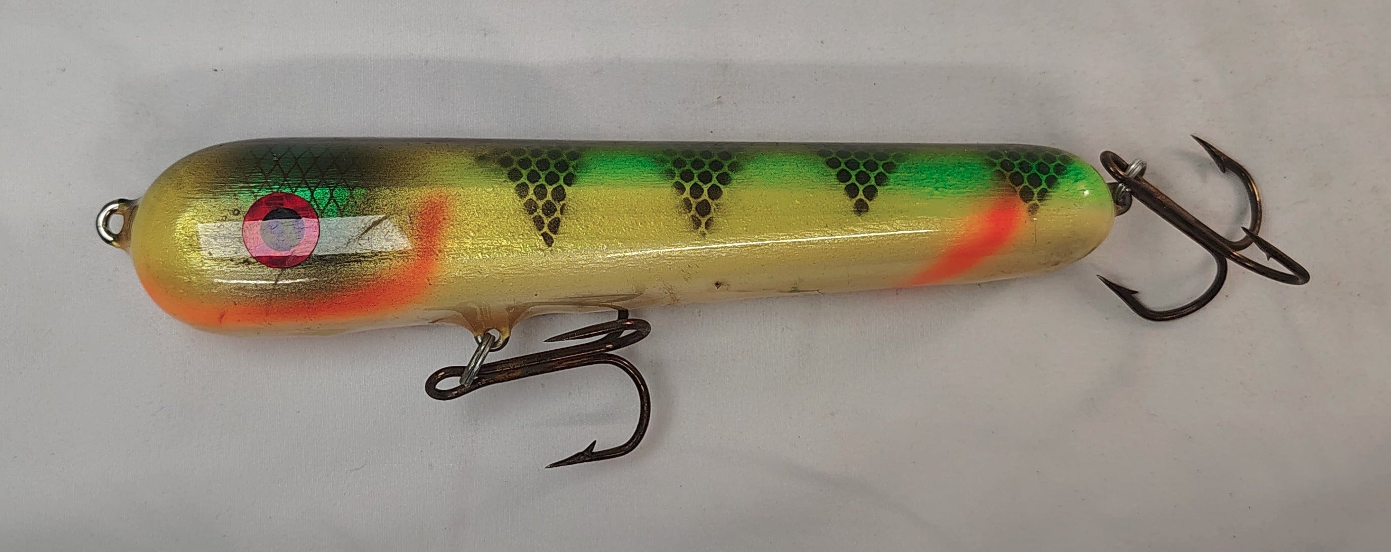 Fishing lure with a colorful pattern on a white background