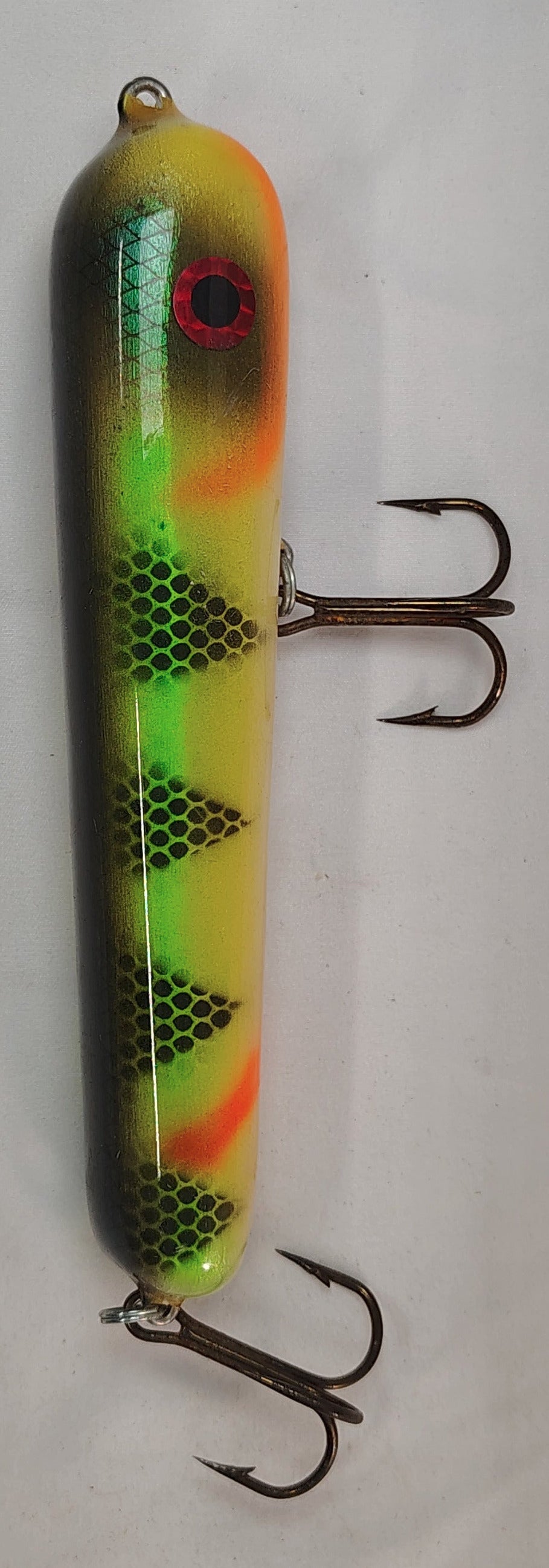 Fishing lure with a colorful pattern on a white background