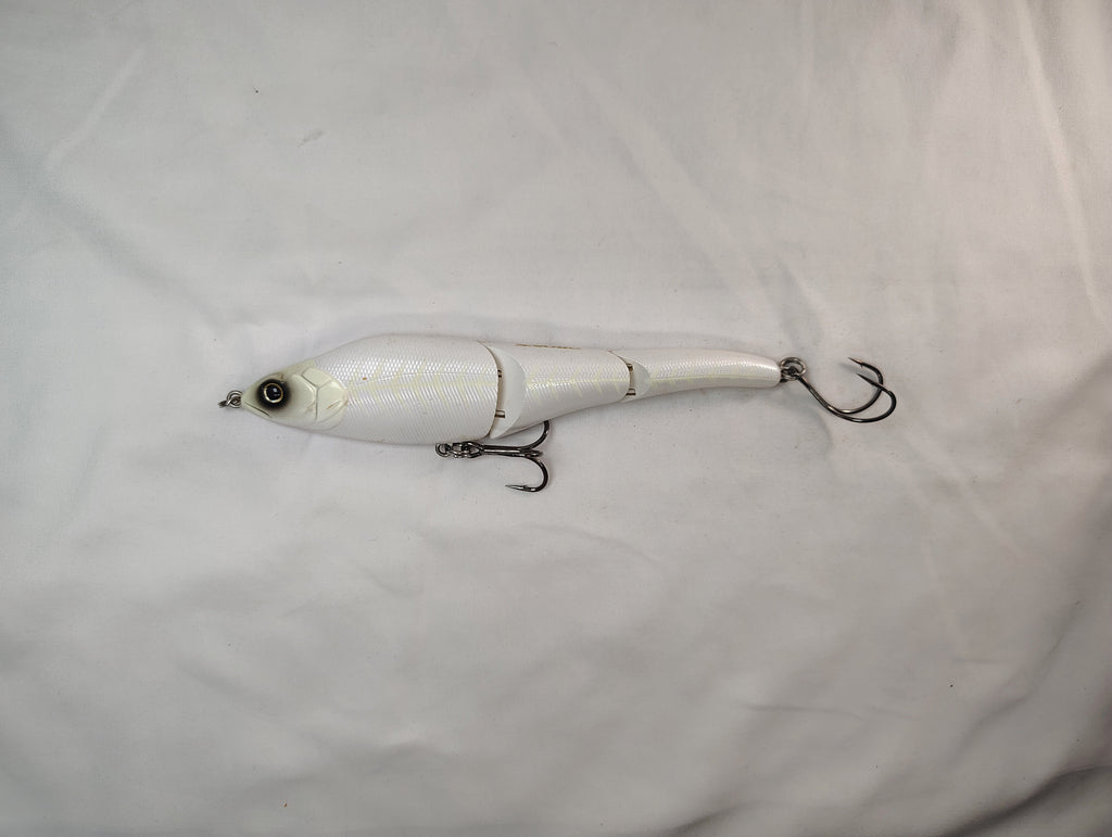 White fishing lure with a hook on a white background