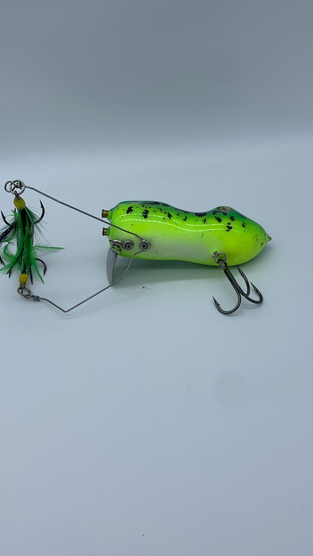 Green fishing lure on a white background