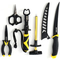 A set of six outdoor survival and fishing tools arranged on a plain white background, including black and yellow-handled shears, a multi-tool, a knife, a sharpener, and a small black cord accessory.