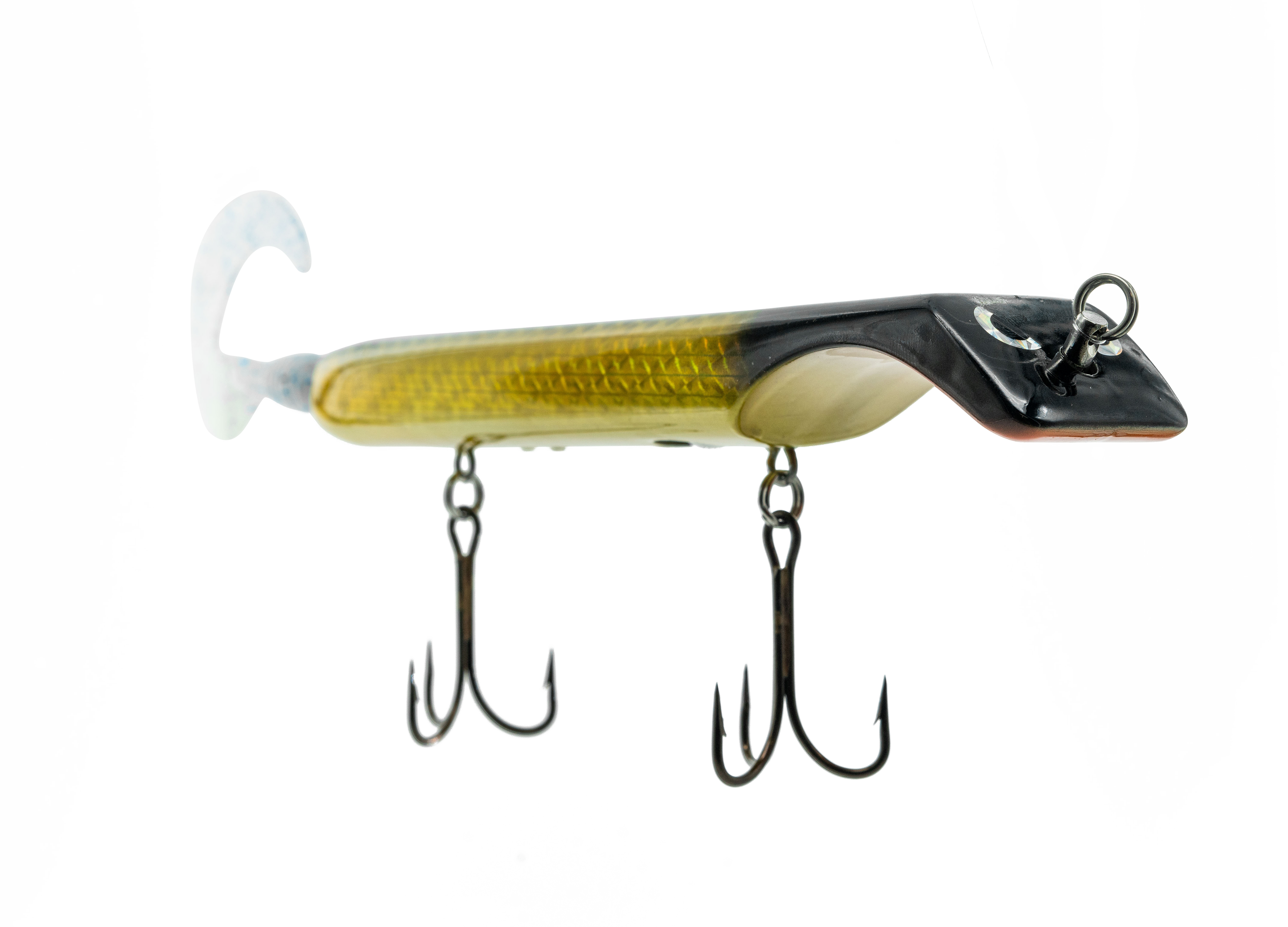 Fishing lure with treble hooks on a white background