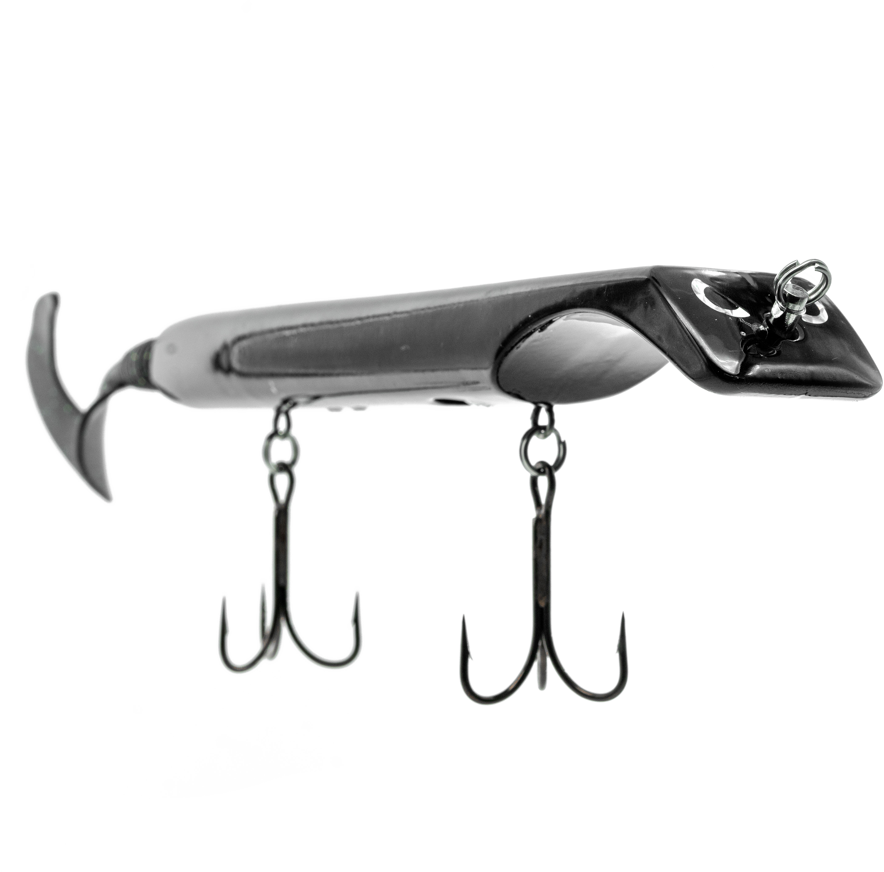 Fishing lure with treble hooks on a white background